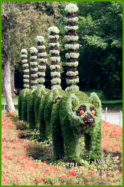 Living Plant Sculpture - Montréal Botanical Garden - At the entrance you are greeted by these comical raccoons marching in a row.